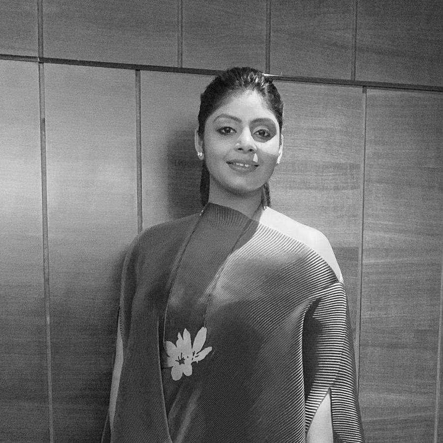 Black and white portrait of Tanya Jain in a pleated one-shoulder drape