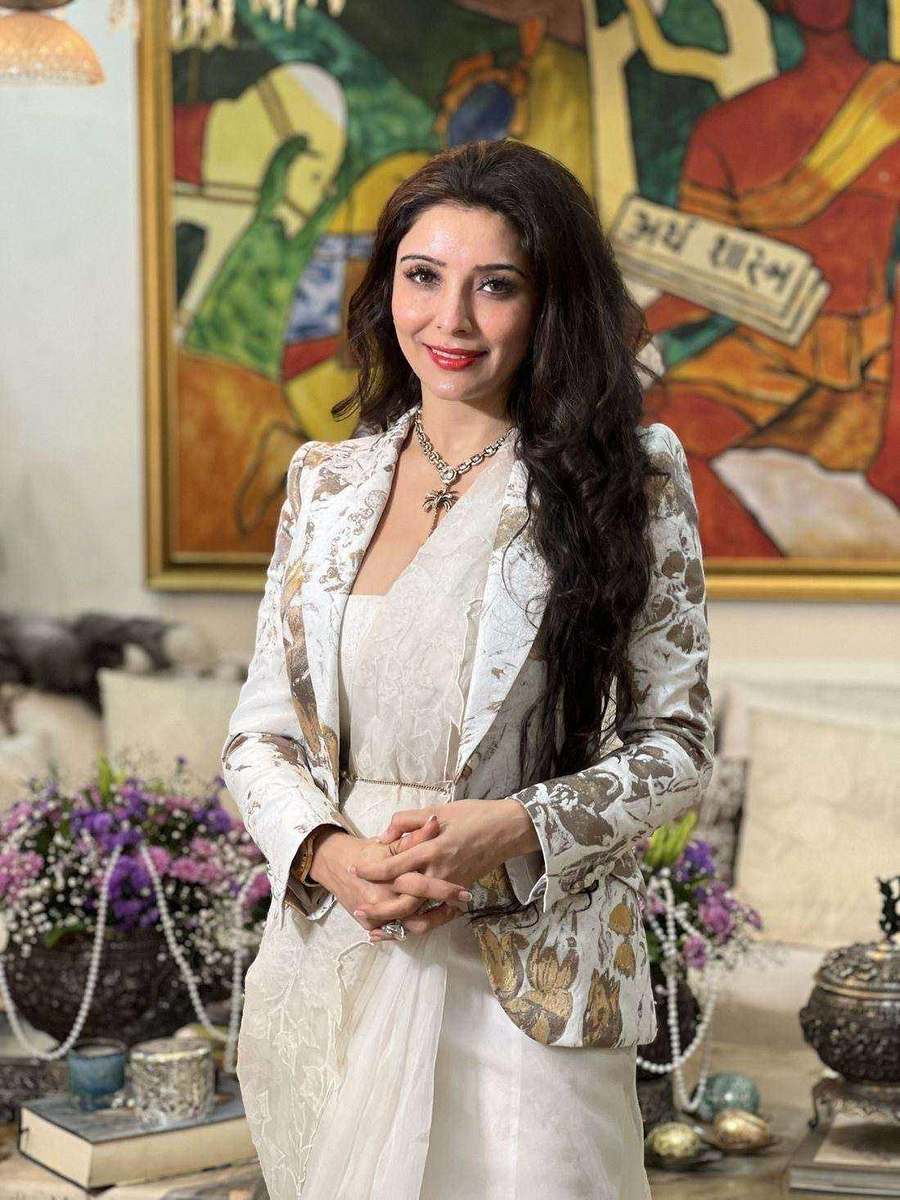 Dr. Jai Madaan, styled by Tanya Jain in an ivory outfit with a printed jacket