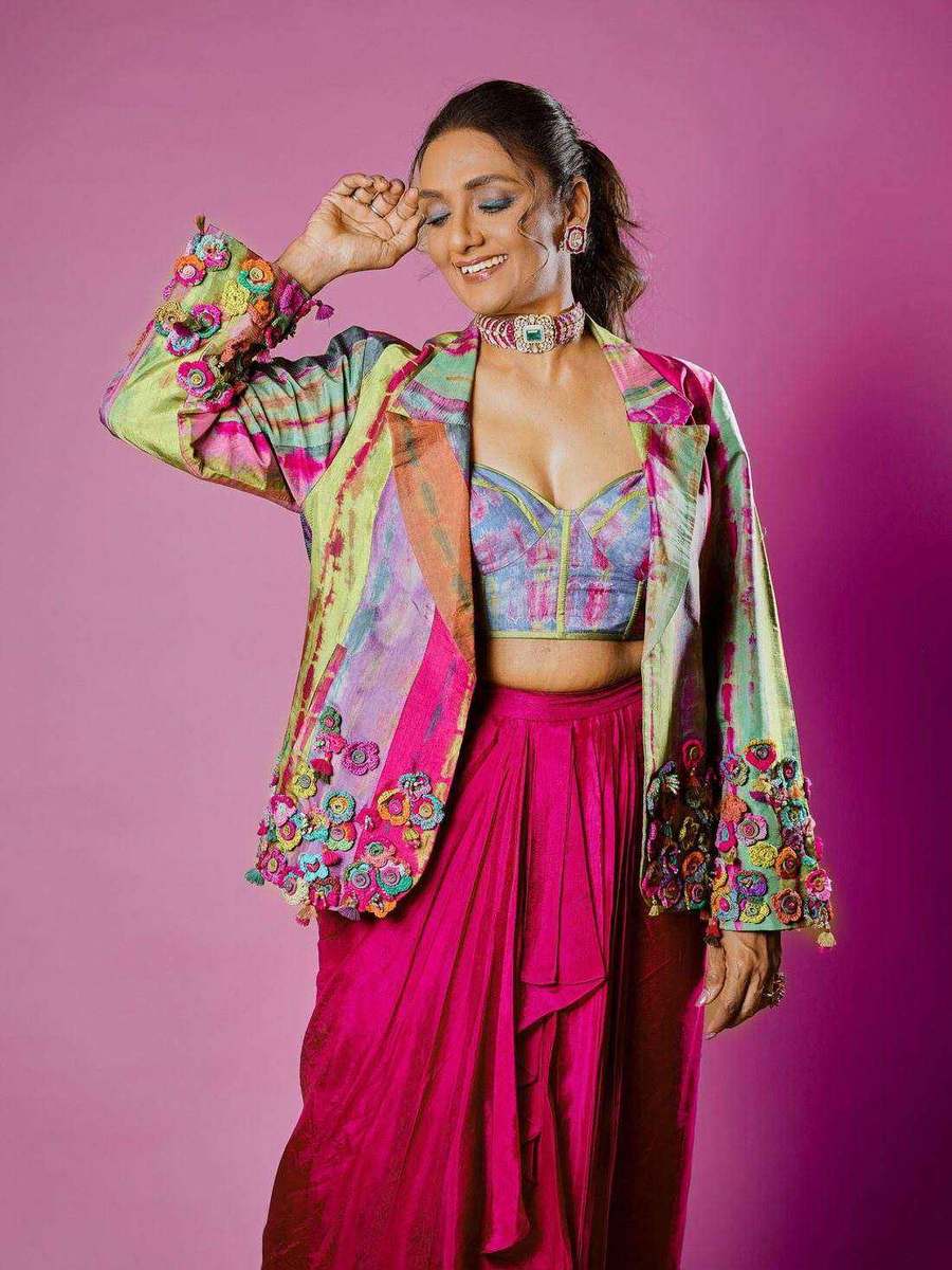Shanthi Priya, styled by Tanya Jain in the same look, one hand raised to her face