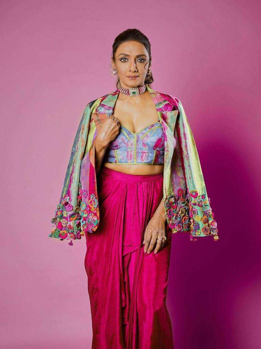 Shanthi Priya, styled by Tanya Jain in a magenta drape and embroidered jacket