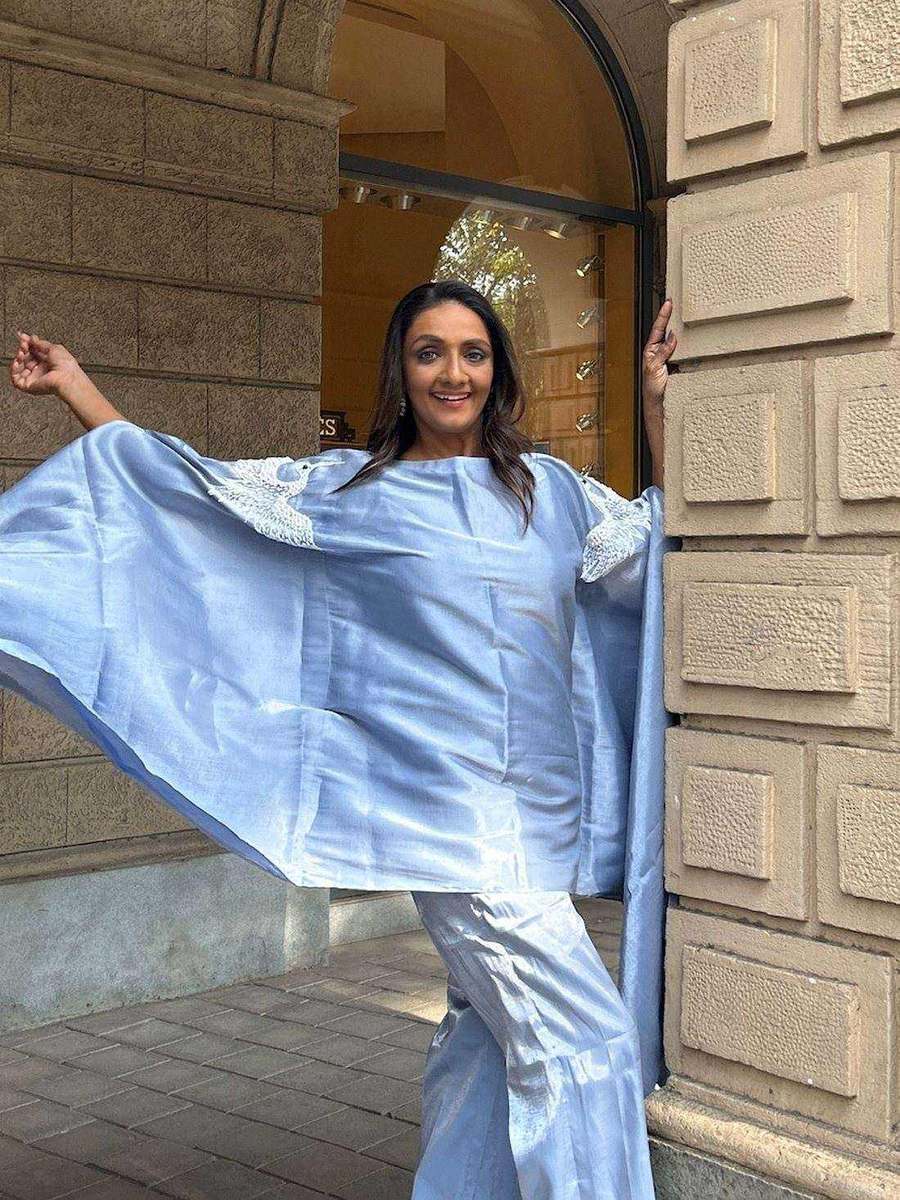 Shanthi Priya, styled by Tanya Jain in the same look, the cape held open