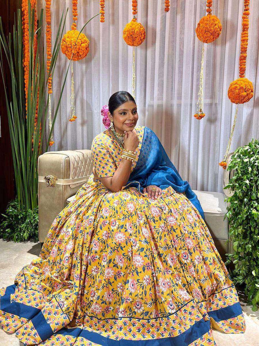 Tanya Jain in a yellow block-printed lehenga with a blue dupatta